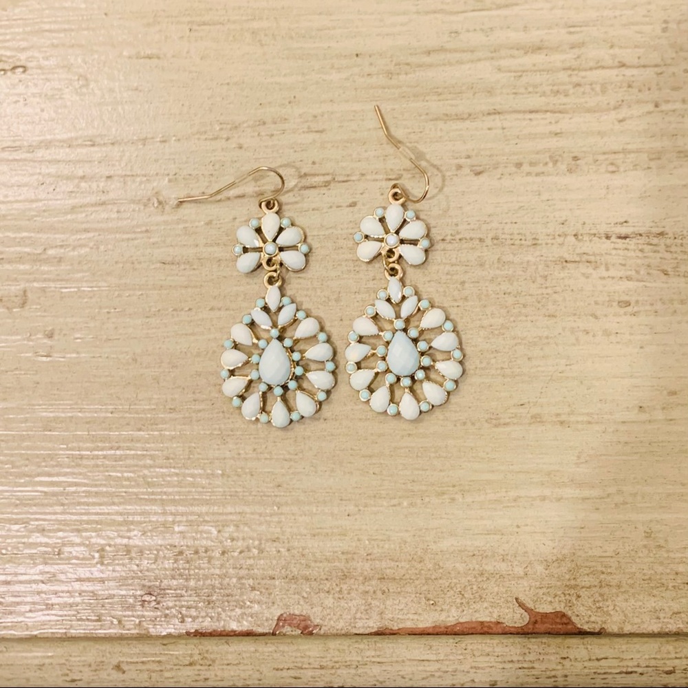 Gold earrings with opaque blue jewels